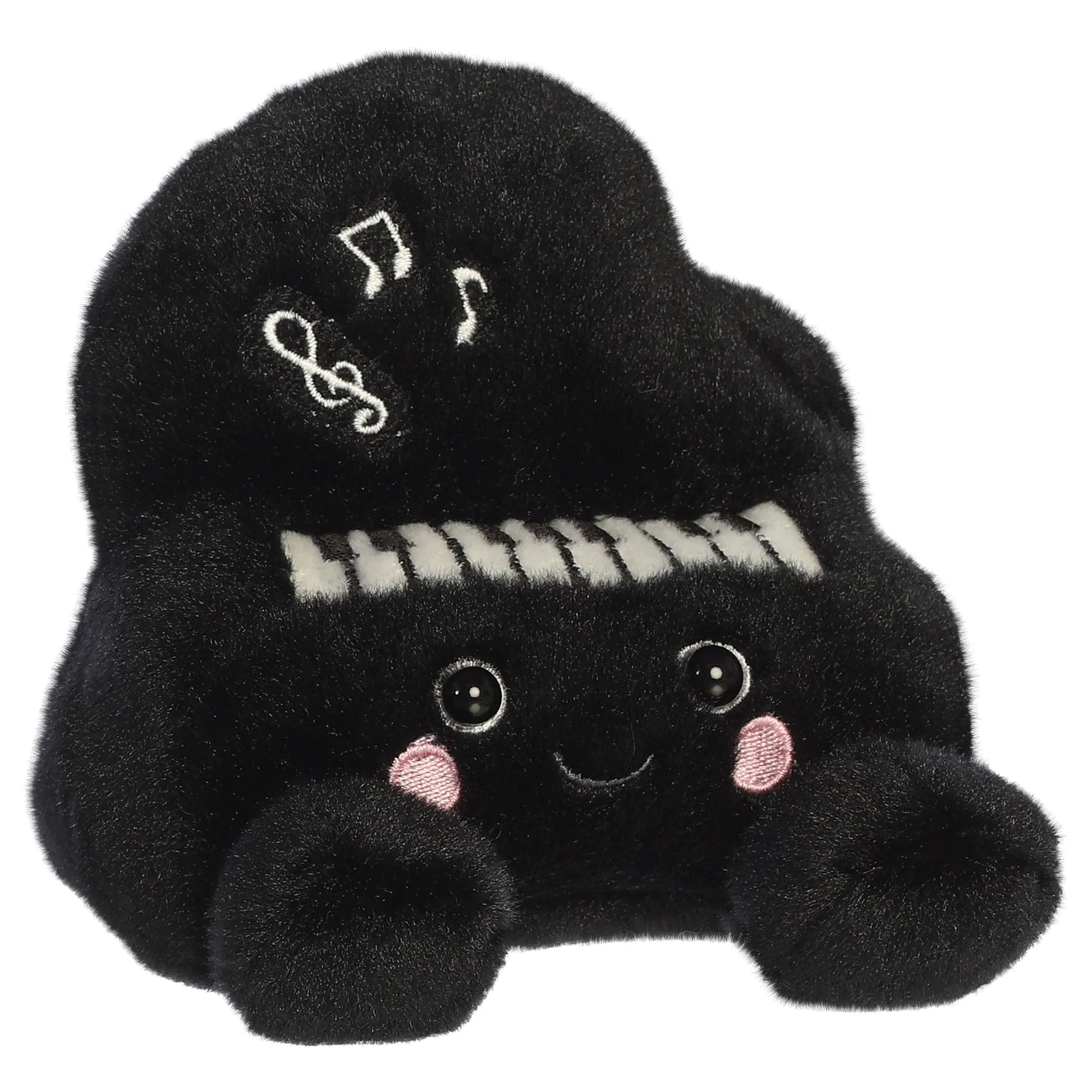 Palm Pals Ragtime Piano plush toy in black with embroidered piano keys, white musical notes, a cute smiling face, and pink blush.