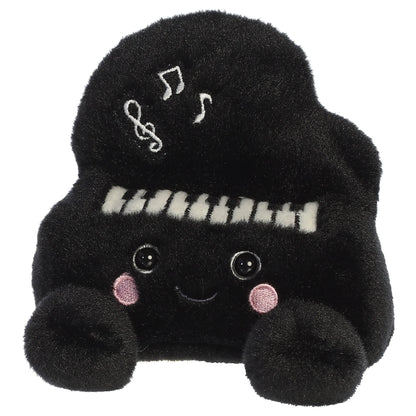 Palm Pals Ragtime Piano plush toy in black with embroidered piano keys, white musical notes, a cute smiling face, and pink blush.