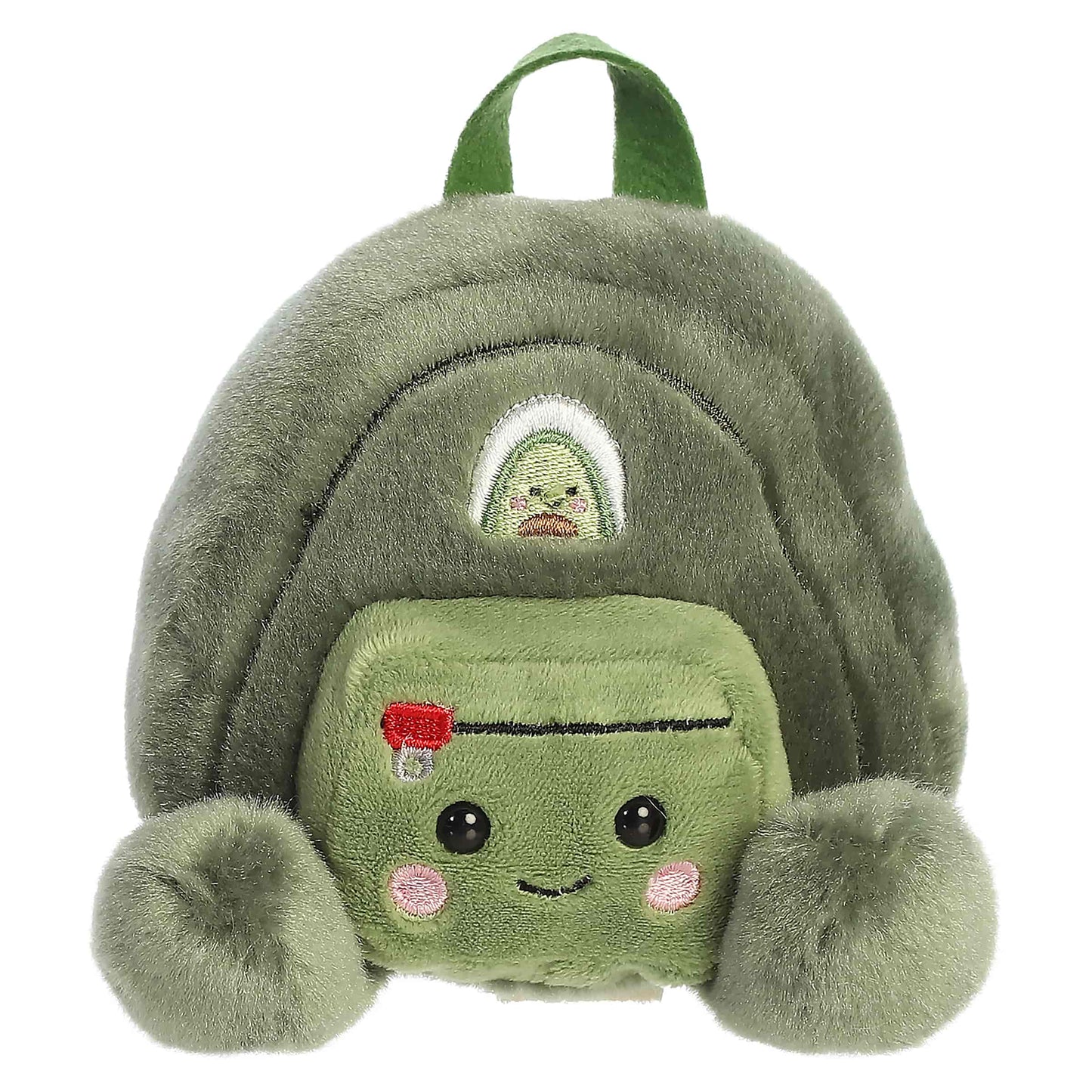 Palm Pals Rainier Backpack, a small green plush shaped like a backpack with a cute blushing face and an avocado patch.