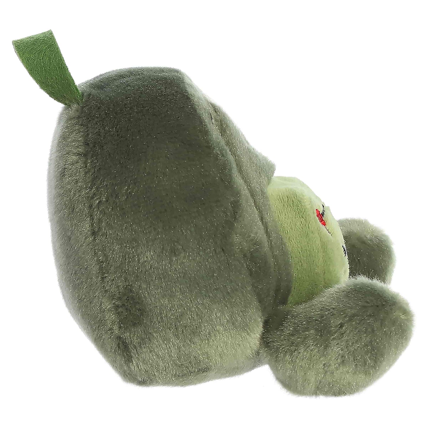 Palm Pals Rainier Backpack, a small green plush shaped like a backpack with a cute blushing face and an avocado patch.