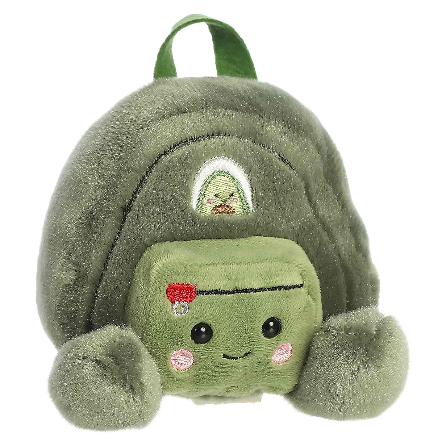 Palm Pals Rainier Backpack, a small green plush shaped like a backpack with a cute blushing face and an avocado patch.