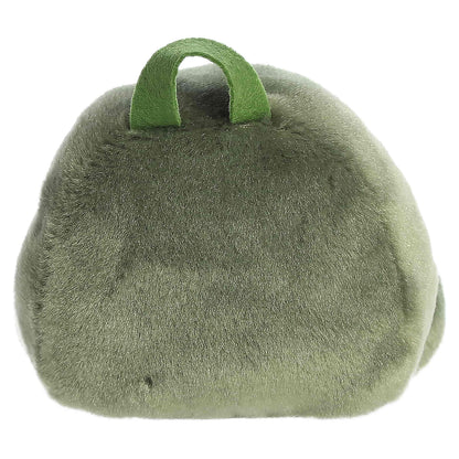 Palm Pals Rainier Backpack, a small green plush shaped like a backpack with a cute blushing face and an avocado patch.