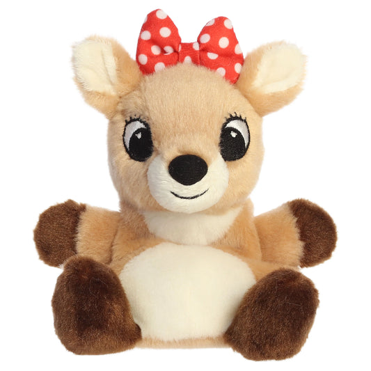 Palm Pals Clarice character plush toy from Rudolph the Red-Nosed Reindeer sitting down with a red polka dot bow.