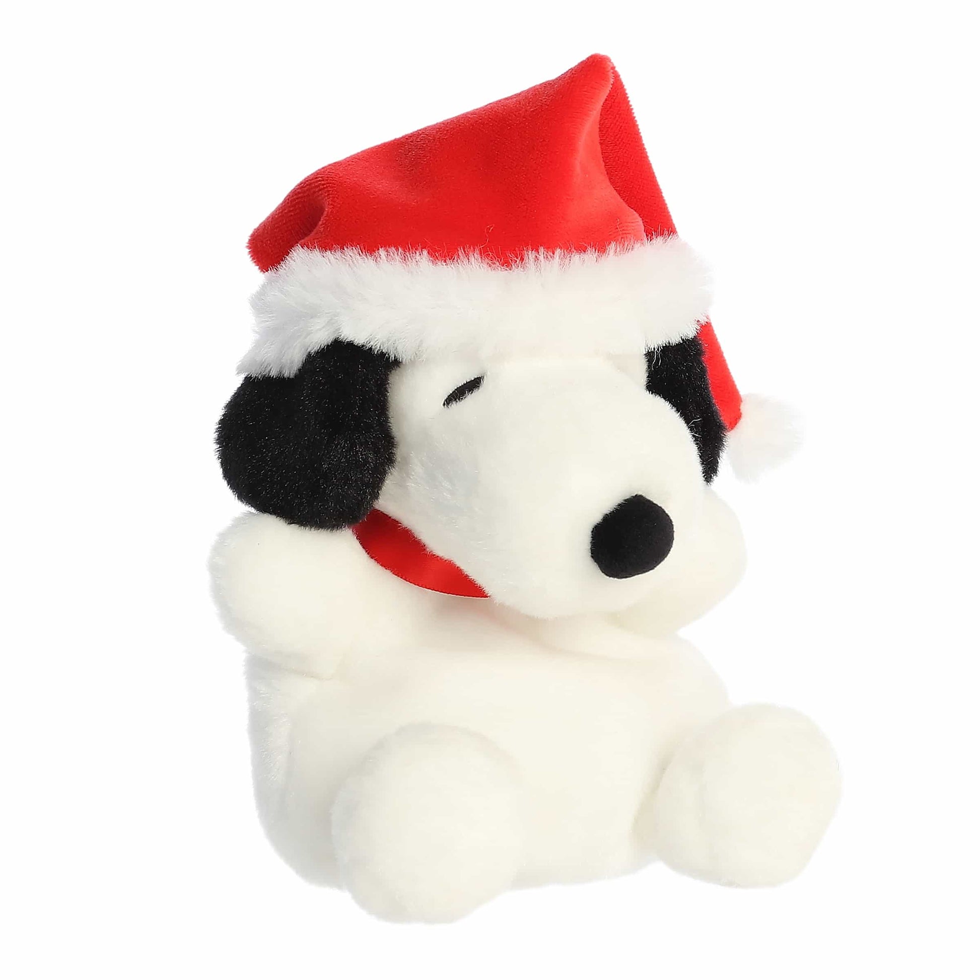 Palm Pals Santa Snoopy plush wearing a red Santa hat with plush white trim, a white pom-pom, and a red collar.