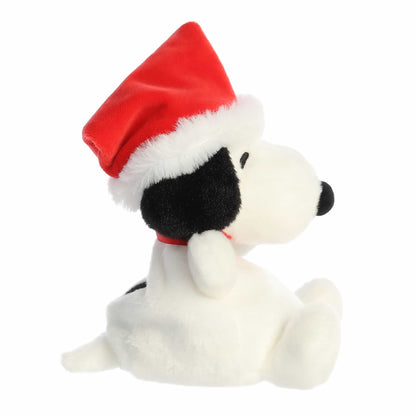 Palm Pals Santa Snoopy plush wearing a red Santa hat with plush white trim, a white pom-pom, and a red collar.