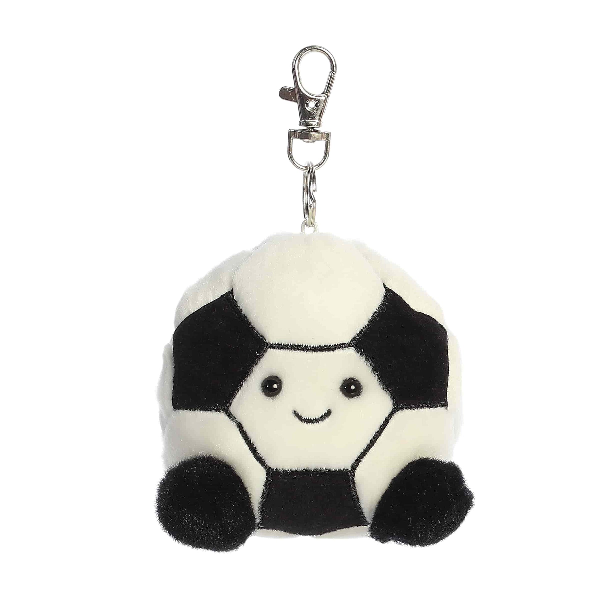 Product view of Palm Pals Striker Soccerball, a 4-inch round plush soccer ball with a smiling face and black feet, featuring a plastic keychain clip.