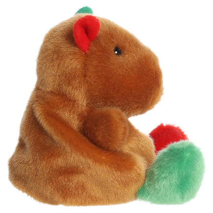 Palm Pals Syd Holiday Capybara 4-inch brown plush with red and green ears, red and green feet, and an embroidered red nose.