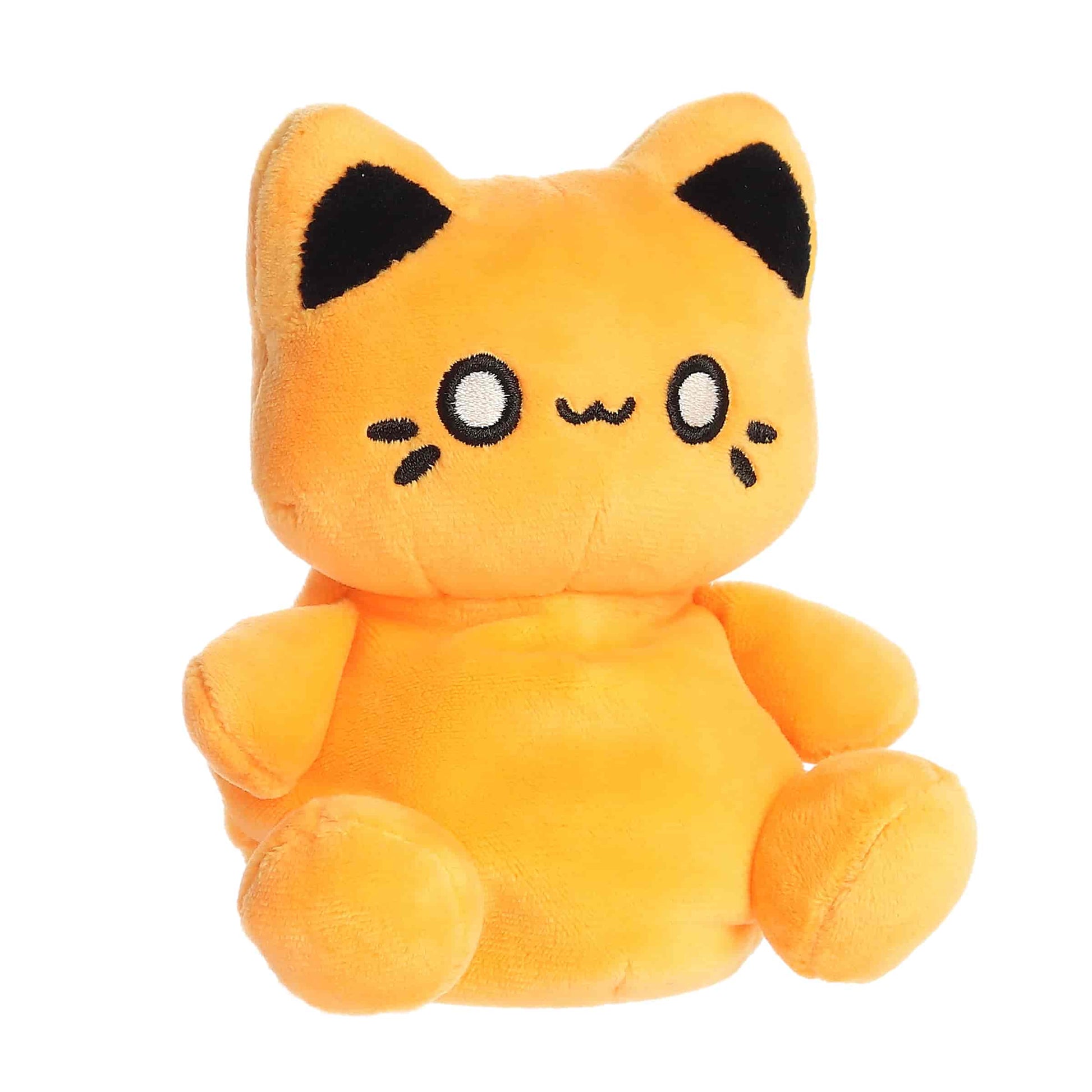 Angled view of Palm Pals Tasty Peach Kinetic Orange Meowchi 5-inch plush soft toy
