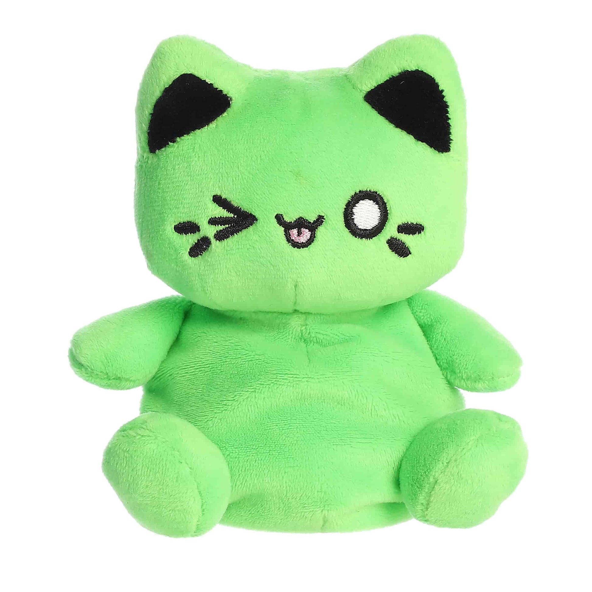 Palm Pals Tasty Peach Toxic Green Meowchi 5-inch plush soft toy, a neon green cat with black ears and a cheeky winking face.