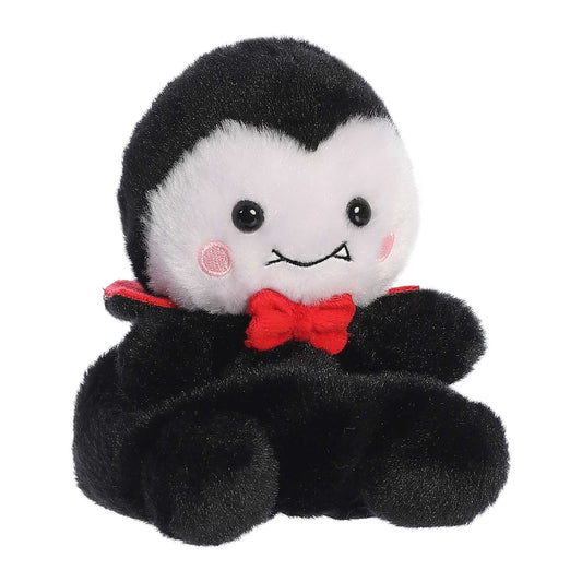 Palm Pals Viktor Vampire 5-inch plush featuring soft black and white fur, a red bow tie, red cape collar, and tiny embroidered fangs.