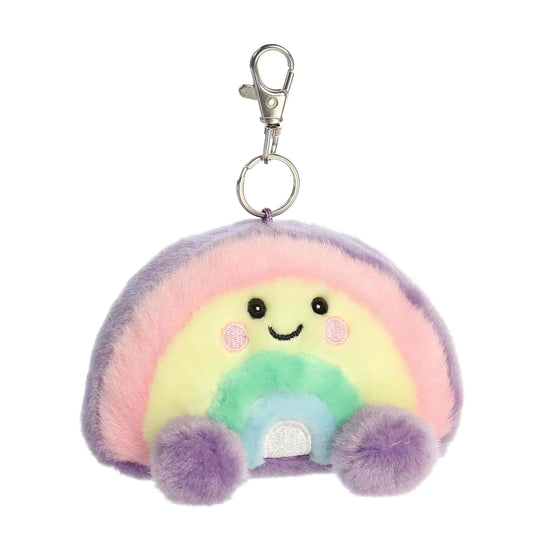 Angled view of Palm Pals Vivi Rainbow 4-inch clip-on plush soft toy