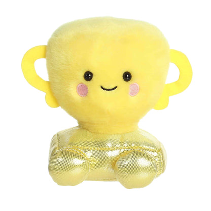 A product photo of the Palm Pals Winner Trophy 5-Inch Plush, a yellow stuffed trophy with a shiny metallic gold base and handles, sitting on a white background.