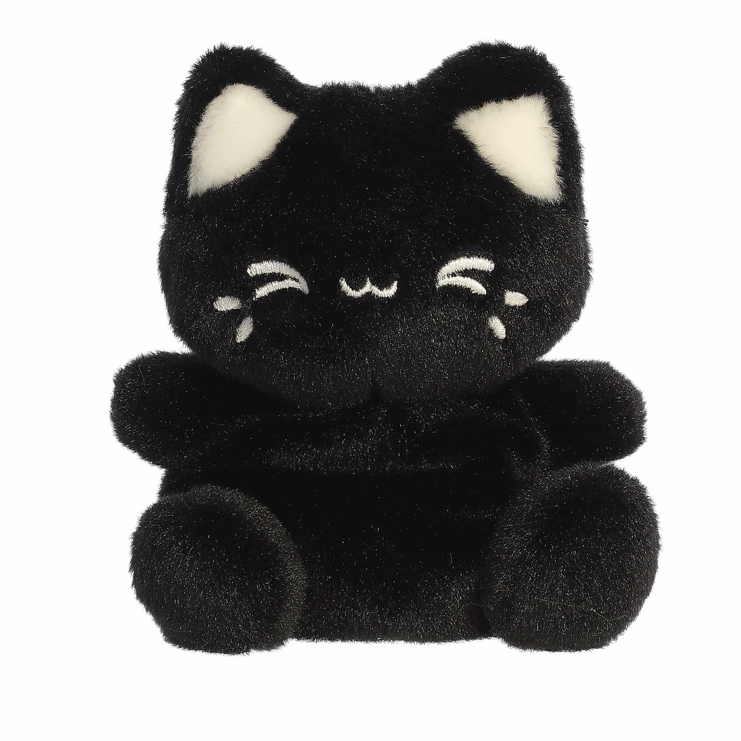 A product photo of the Palm Pals Tasty Peach Black Sesame Meowchi plush, a small black cat with white smiling eyes and white inner ears, sitting on a white background.