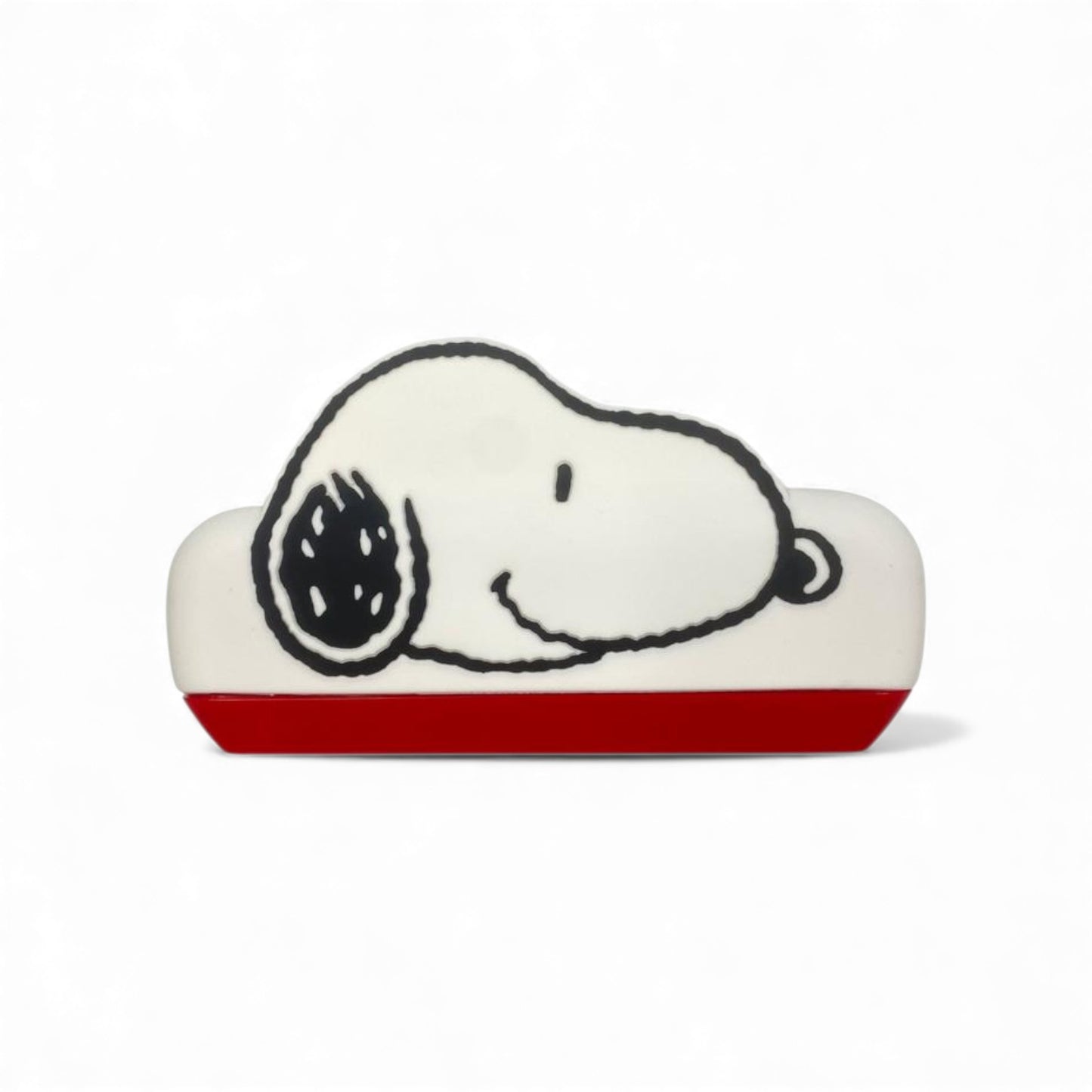 Product view of the Peanuts Snoopy Harmonica, a white and red musical instrument shaped like Snoopy's head.