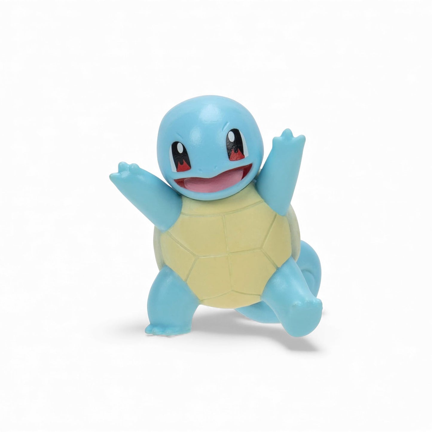 Toy figure of a blue and yellow character on a white background