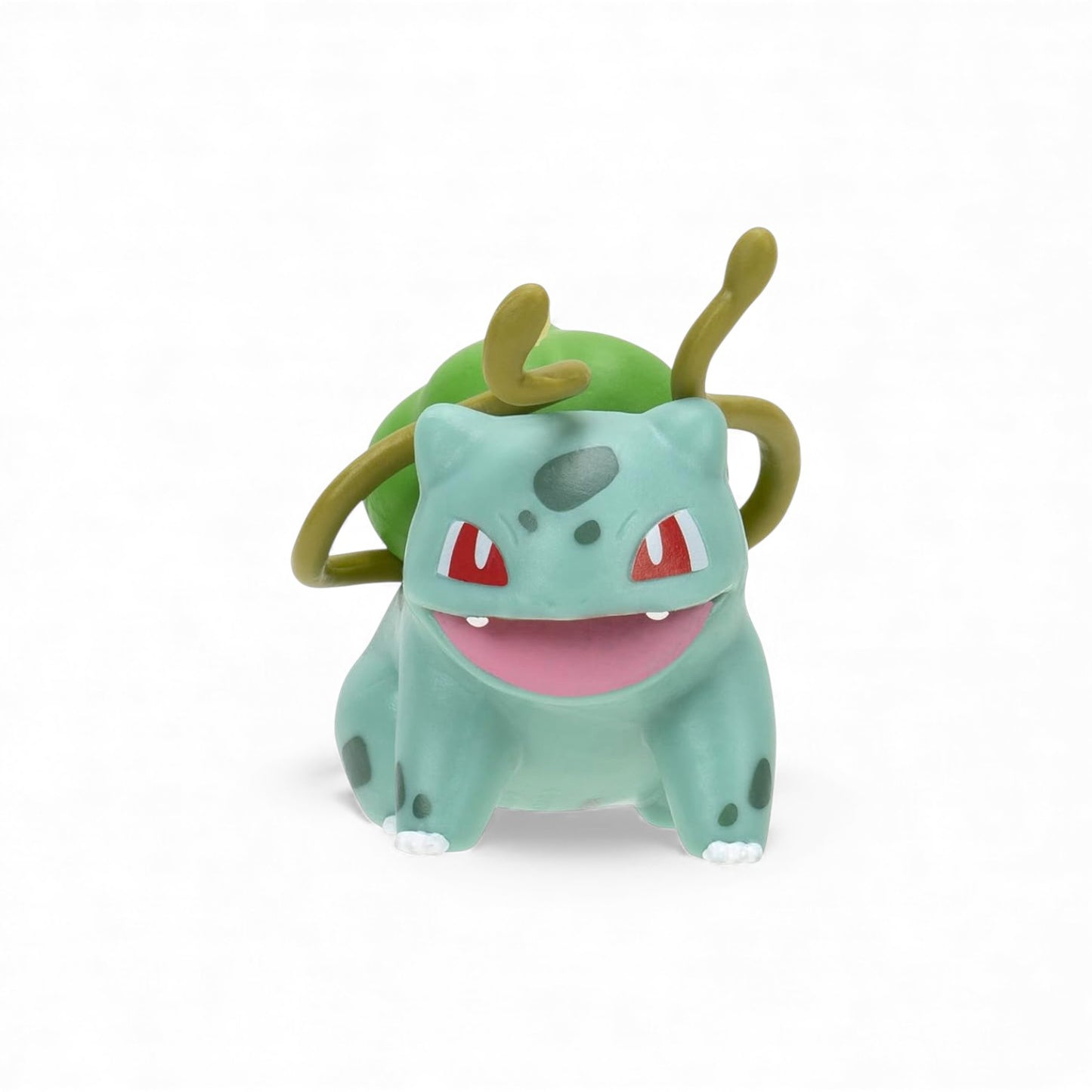 Green Bulbasaur with red eyes and a pink mouth on a white backround