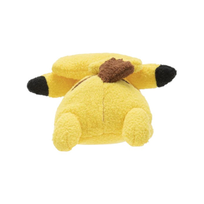 Yellow plush toy with brown ears on a white background