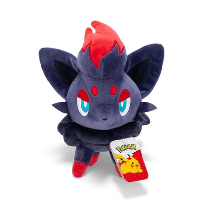 Front view of the Pokémon 8-Inch Zorua Plush, a dark grey fox-like Pokémon with a red mane tuft and blue eyes, featuring a mischievous expression.