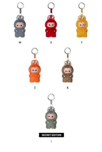 Set of colorful keychains with different designs on a white background