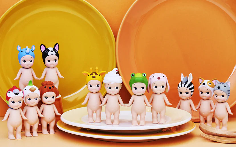 Set of small figurines on a yellow and orange background