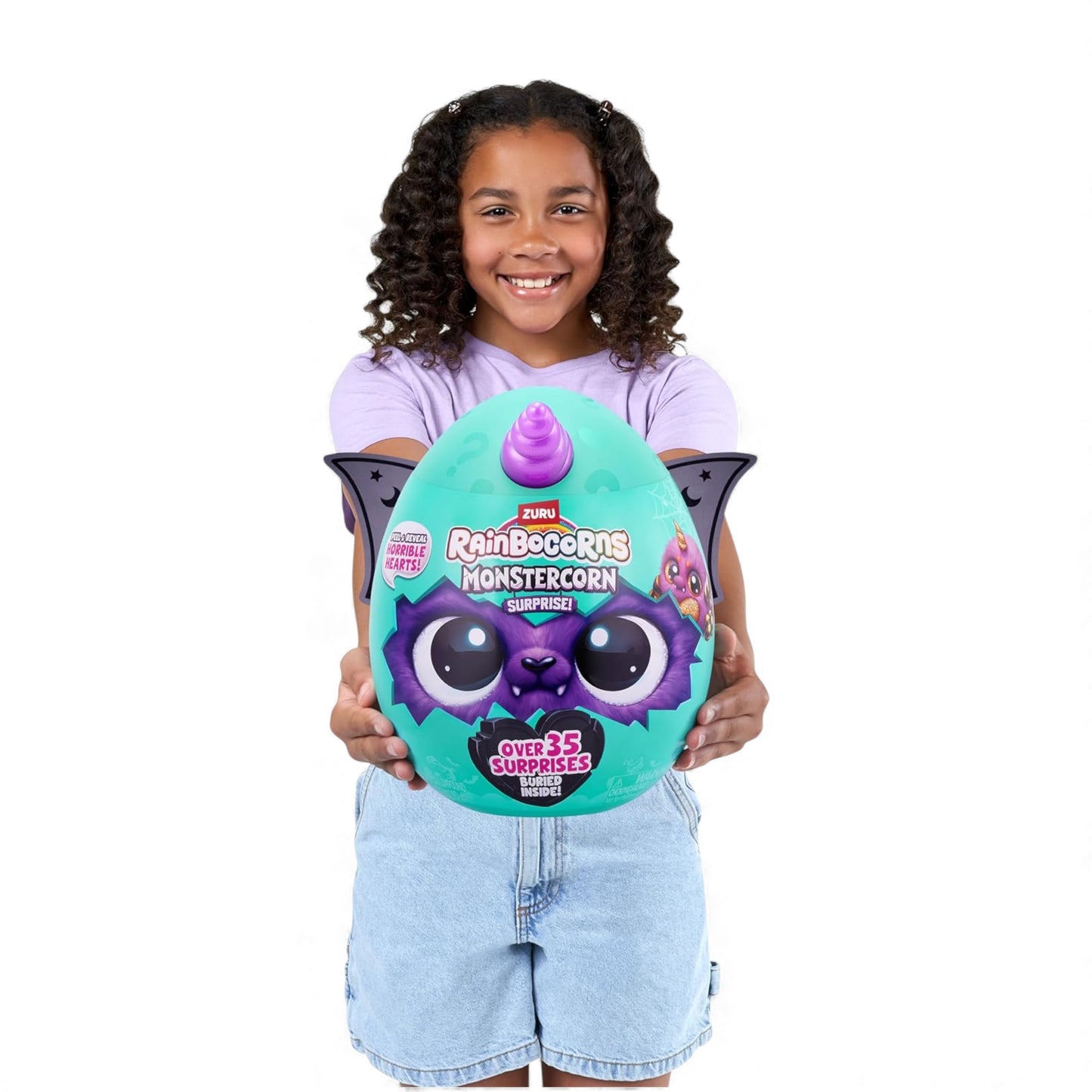 Child holding a colorful toy egg with a character on a white background