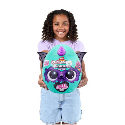 Child holding a colorful toy egg with a character on a white background