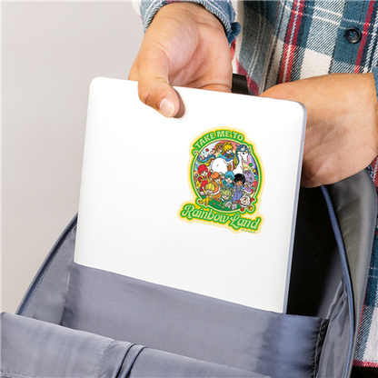 Hand holding a white notebook with a colorful logo on the cover, against a neutral background.