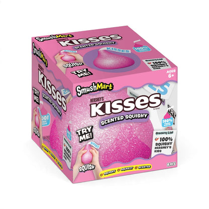 An authentic RMS Crazy Fun SmushMart Hershey's Kisses squishy fidget toy in bright pink, packaged in a branded display box.