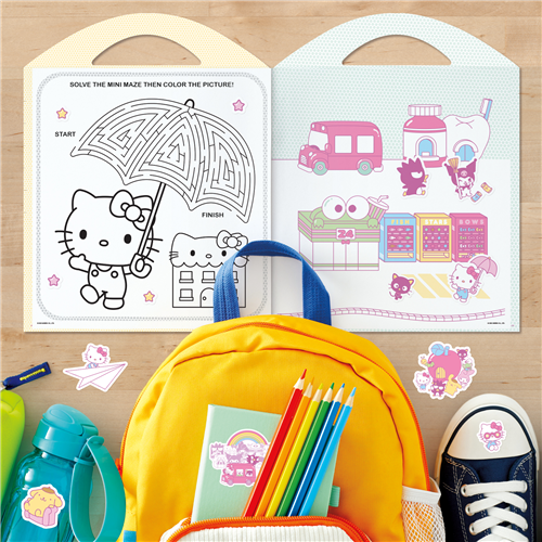 Coloring book with maze and pictures, backpack, coloring supplies, and shoes on a wooden surface