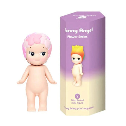 Sunny Angel doll with pink hair and packaging on a white background