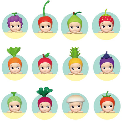 Set of 12 cartoon baby figures with colorful fruit and vegetable hats on a white background.