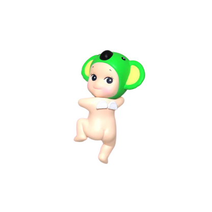 Toy figure of a baby with a green koala hat on a white background