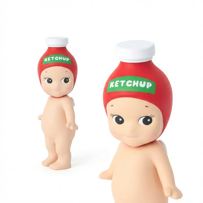 Two dolls resembling a baby and a ketchup bottle with 'Ketchup' label on a white background