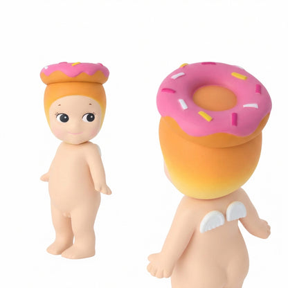Two figurines with donut-shaped heads on a white background