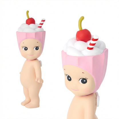 Two toy figures resembling ice cream cones with cherry and straw toppings on a white background.