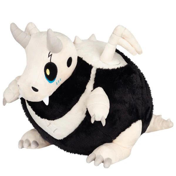 Squishable Bone Dragon Plush toy resembling a black and white dragon with large eyes on a white background