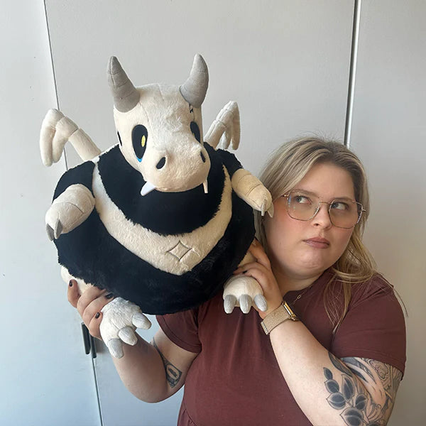 Woman holding Squishable Bone Dragon