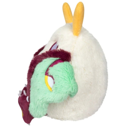 Squishable Alter Egos Series 21 Luna Mothman plush with cream fur, yellow antennae, burgundy feet, and mint green wings.