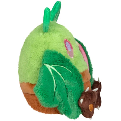 Squishable Alter Egos Series 21 Plant Mothman plush sitting in a plush brown flowerpot with bright green fur, leafy antennae, and leafy wings.
