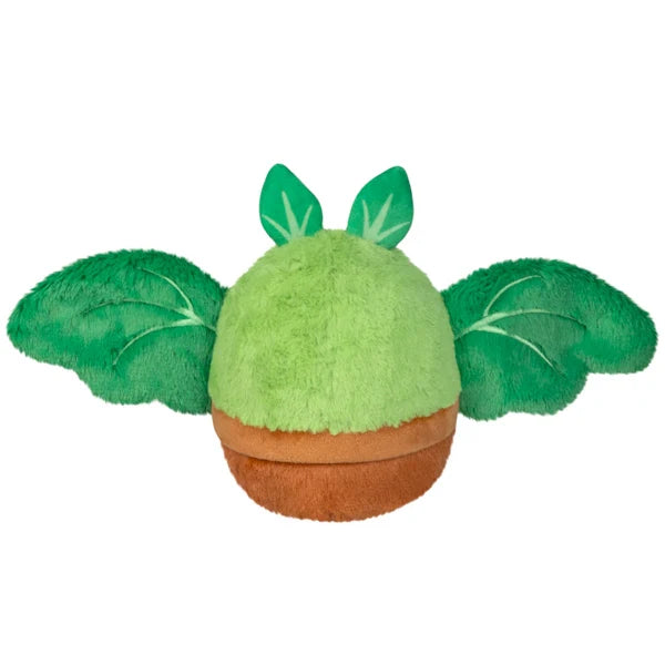 Squishable Alter Egos Series 21 Plant Mothman plush sitting in a plush brown flowerpot with bright green fur, leafy antennae, and leafy wings.
