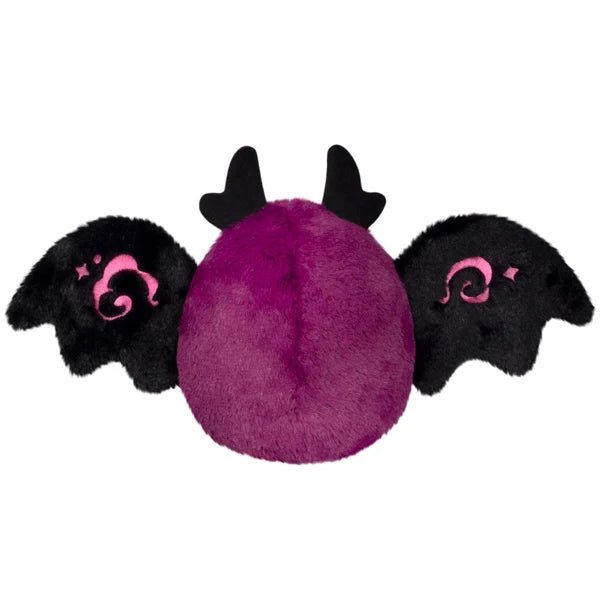 Squishable Alter Egos Series 21 Poison Mothman plush featuring deep magenta fur, glowing pink eyes, and black wings with pink embroidery.