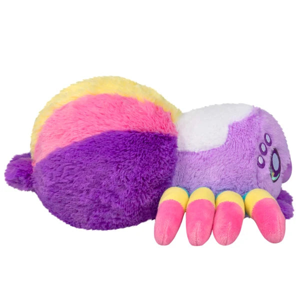 Squishable Mini Rainbow Spider plush with a colorful segmented body, eight striped legs, and big purple sparkling eyes.