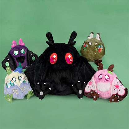 GRoup of Squishable Mothman plush of varying sizes. 