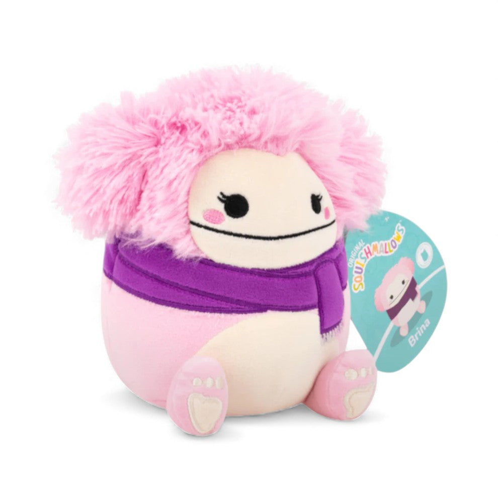 A product photo of the 5-inch Fall Squishmallows Brina the Bigfoot, a pink plush with fluffy pink hair and a purple scarf.