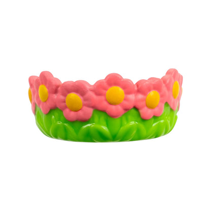 Flower-shaped toy with pink flowers and yellow centers on a white background
