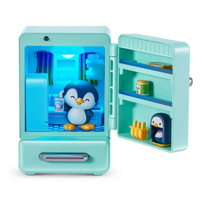 Toy refrigerator with penguin figures and items inside on a white background