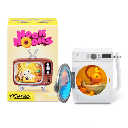 Toy figure of a character in a washing machine with 'Nook Nooks' packaging next to it.