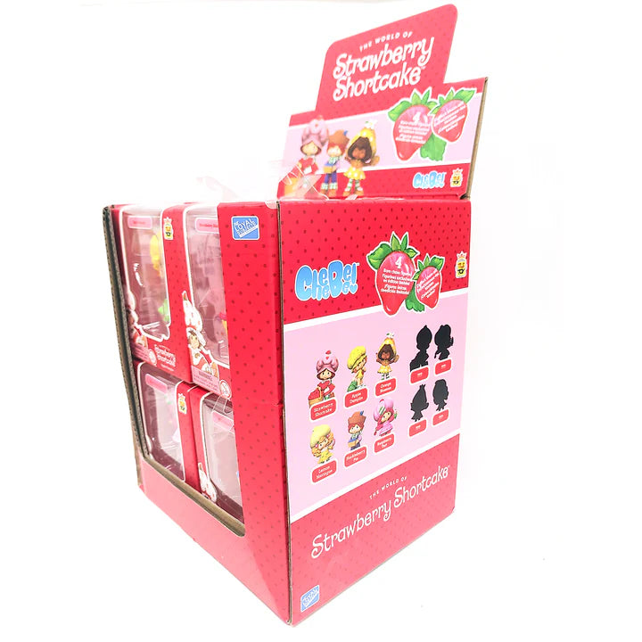 Display box for Strawberry Shortcake toys with character figures and packaging.