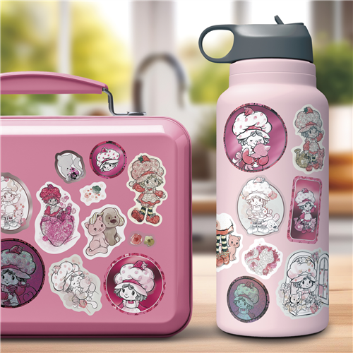 Pink lunch box and water bottle with character stickers on a blurred background