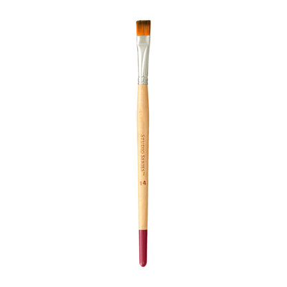 Paintbrush with wooden handle and red ferrule on a white background